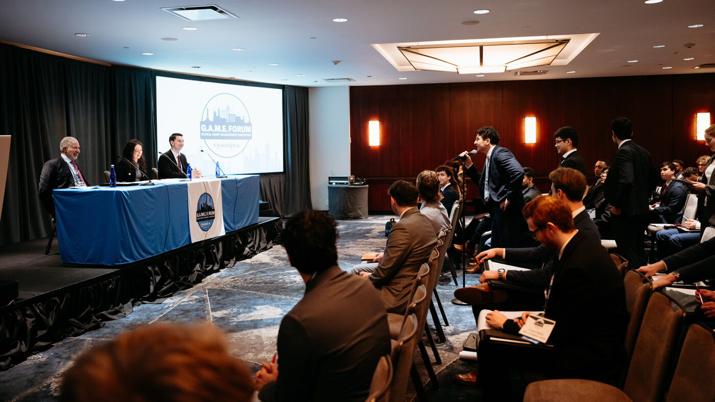 Panelists present a keynote focused on investment banking at GAME Forum.