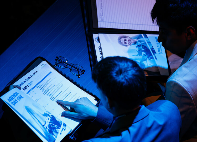 GAME Forum attendees observe the schedule for the first day of the event.