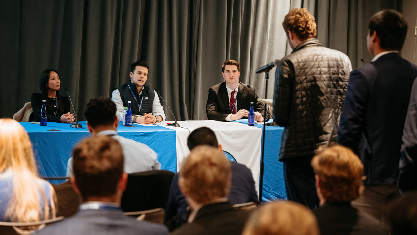 Ross Kulaga and Grace Corfield moderate a keynote chat with Larry Hamdan at GAME Forum.
