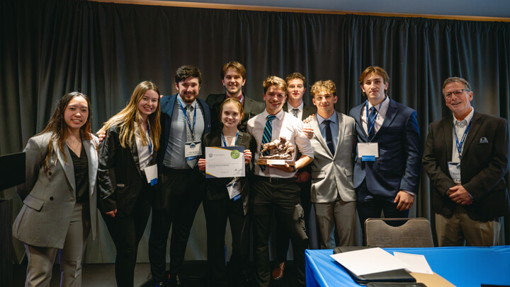 Awardees representing the Undergraduate Value category stand on stage with their certificate at the GAME Forum Poster Competition.