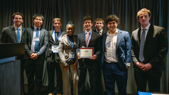 Undergraduate Small Fund category awardees pose for a group photo on stage during the GAME Forum Poster Competition Awards Ceremony.
