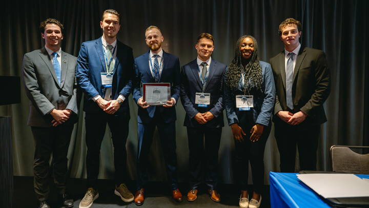 Undergraduate Small Fund category awardees pose for a group photo on stage during the GAME Forum Poster Competition Awards Ceremony.