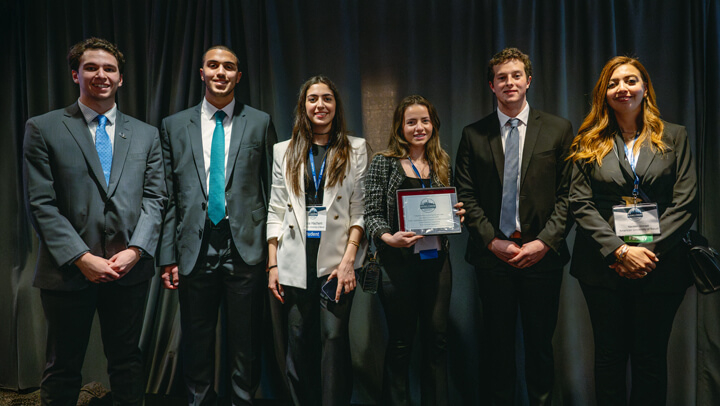 Poster Session awardees gather on stage with their award at the GAME Forum Awards Ceremony.