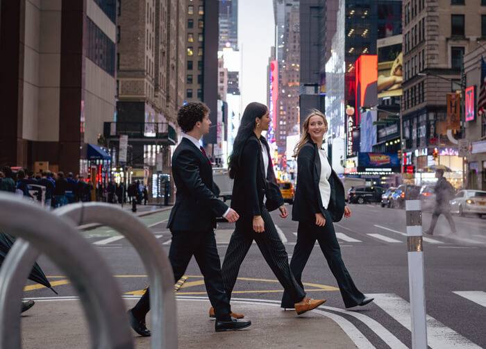Quinnipiac students cross an intersection in Times Square.